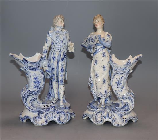 A pair of Continental porcelain figural spill vases